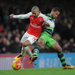 Print of Theo Walcott being challenged by Wayne Routledge Print of Theo Walcott being challenged by Wayne Routledge