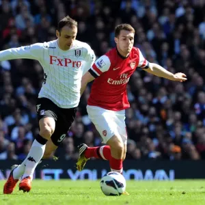 Ramsey Closes In: Intense Battle Between Aaron Ramsey and Dimitar Berbatov in Fulham vs Arsenal Premier League Clash Ramsey Closes In: Intense Battle Between Aaron Ramsey and Dimitar Berbatov in Fulham vs Arsenal Premier League Clash