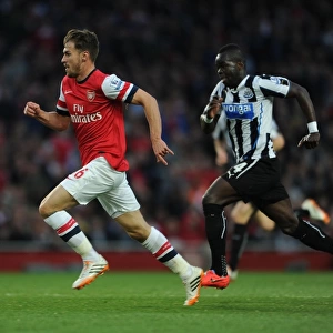 Ramsey Outpaces Tiote: Intense Rivalry in Arsenal vs. Newcastle United, Premier League, 2013/14