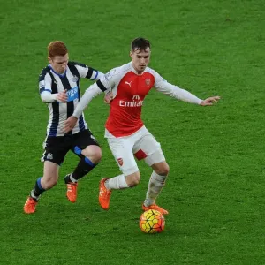 Ramsey Stands Firm: Arsenal's Midfielder Fends Off Newcastle's Colback in Intense Premier League Clash