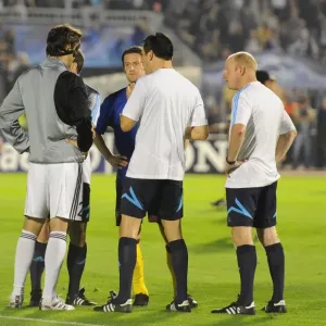 Referee Wolfgang Stark with Arsenal captain Tomas Rosicky and Patrizan captain Mladen Krstajic