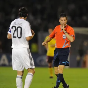 Referee Wolfgang Stark with Patrizan defender Mladen Krstajic. Partizan Belgrade 1