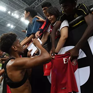 Reiss Nelson Greets Fans: Arsenal's Star Player Connects with Supporters after Arsenal vs. Paris Saint-Germain in Singapore (2018)