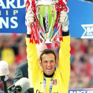 Richard Wright lifts the F. A. Barclaycard Premiership Trophy