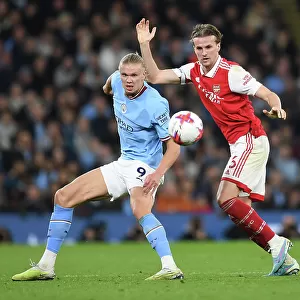 Rivalry Renewed: Holding Stands Firm Against Haaland in Manchester City vs. Arsenal Clash (Premier League 2022-23)