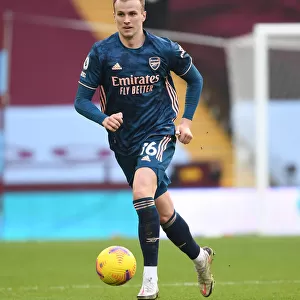 Rob Holding in Action at Empty Villa Park: Arsenal's Premier League Match Amidst COVID-19 Restrictions, February 2021