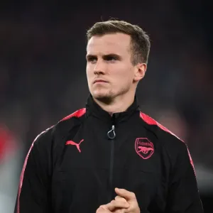 Rob Holding: Arsenal's Defensive Fortress Ahead of Red Star Belgrade Clash