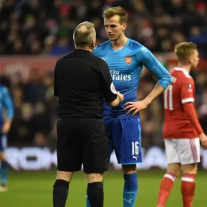 Rob Holding in Deep Conversation with Referee John Moss during Nottingham Forest vs Arsenal FA Cup Clash Rob Holding in Deep Conversation with Referee John Moss during Nottingham Forest vs Arsenal FA Cup Clash
