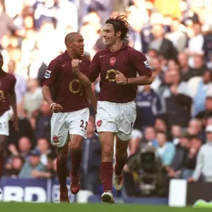 Robert Pires celebrates scoring the Arsenal goal with Gael Clichy