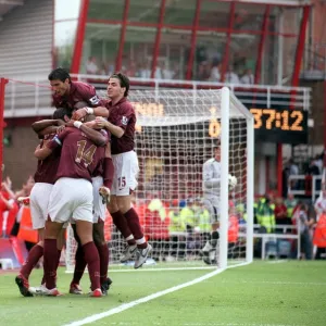 Robert Pires celebrates scoring Arsenals 1st goal with Jose Reyes and Cesc Fabregas