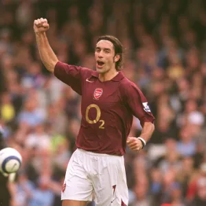 Robert Pires celebrates scoring Arsenals goal from the penalty spot