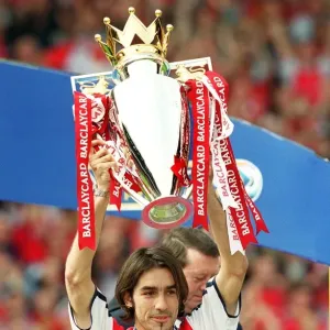 Robert Pires lifts the F. A. Barclaycard Premiership Trophy Robert Pires lifts the F. A. Barclaycard Premiership Trophy