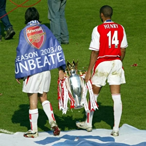Robert Pires and Thierry Henry with the Premiership trophy