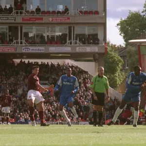 Robin van Perise scores Arsenals goal under pressure from Emile Heskey (Birmingham)
