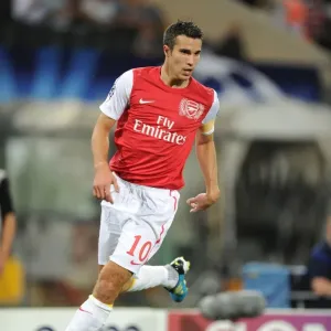 Robin van Persie in Action: Udinese Calcio vs. Arsenal FC, UEFA Champions League Play-Off, 2011 Robin van Persie in Action: Udinese Calcio vs. Arsenal FC, UEFA Champions League Play-Off, 2011