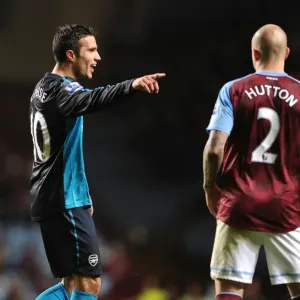 Robin van Persie and Alan Hutton: A Moment of Respite Amidst the Aston Villa vs. Arsenal Rivalry (2011-12)