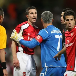 Robin van Persie (Arsenal) Antonis Nikopolidis (Olympiacos) Robin van Persie (Arsenal) Antonis Nikopolidis (Olympiacos)