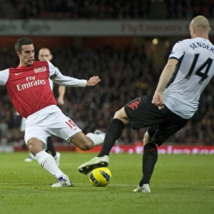 Robin van Persie of Arsenal breaks shoots Philippe Senderos of Fulham during the Barclays Premier League match between Arsenal and Fulham at Emirates Stadium on November 26, 2011 in London, England. Credit; Arsenal