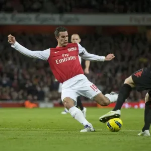 Robin van Persie of Arsenal breaks shoots Philippe Senderos of Fulham during the Barclays Premier League match between Arsenal and Fulham at Emirates Stadium on November 26, 2011 in London, England. Credit; Arsenal Robin van Persie of Arsenal breaks shoots Philippe Senderos of Fulham during the Barclays Premier League match between Arsenal and Fulham at Emirates Stadium on November 26, 2011 in London, England. Credit; Arsenal