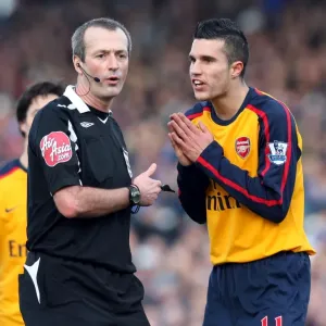Robin van Persie (Arsenal) chats to referee Martin Atkinson Robin van Persie (Arsenal) chats to referee Martin Atkinson