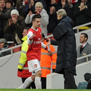 Robin van Persie (Arsenal) is congratulated by Manager Arsene Wenger on his hat trick as he is subbed. Arsenal 3: 0 Wigan Athletic. Barclays Premier League. Emirates Stadium, 22 / 1 / 11. Credit : Arsenal Football Club /