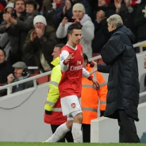 Robin van Persie (Arsenal) is congratulated by Manager Arsene Wenger on his hat trick as he is subbed. Arsenal 3: 0 Wigan Athletic. Barclays Premier League. Emirates Stadium, 22 / 1 / 11. Credit : Arsenal Football Club / Robin van Persie (Arsenal) is congratulated by Manager Arsene Wenger on his hat trick as he is subbed. Arsenal 3: 0 Wigan Athletic. Barclays Premier League. Emirates Stadium, 22 / 1 / 11. Credit : Arsenal Football Club /