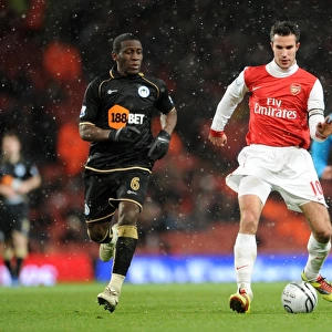 Robin van Persie (Arsenal) Hendry Thomas (Wigan). Arsenal 2: 0 Wigan Athletic