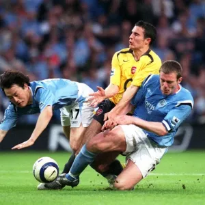 Robin van Persie (Arsenal) Jihai Sun and Richard Dunne (Man City)