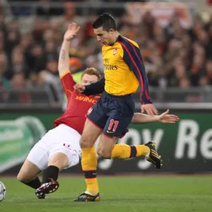 Robin van Persie (Arsenal) John Arne Riise (Roma)