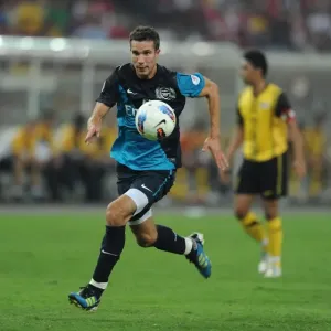 Print of Robin van Persie in action during Malaysia XI 0:4 Arsenal match Print of Robin van Persie in action during Malaysia XI 0:4 Arsenal match