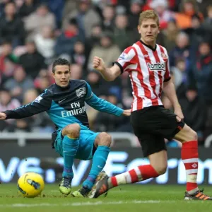 Robin van Persie (Arsenal) Michael Turner (Sunderland). Sunderland 1: 2 Arsenal Robin van Persie (Arsenal) Michael Turner (Sunderland). Sunderland 1: 2 Arsenal