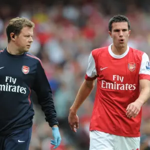 Robin van Persie with Arsenal physio Colin Lewin. Arsenal 6: 0 Blackpool