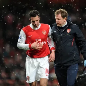Robin van Persie (Arsenal) with Physio Colin Lewin. Arsenal 2: 0 Wigan Athletic