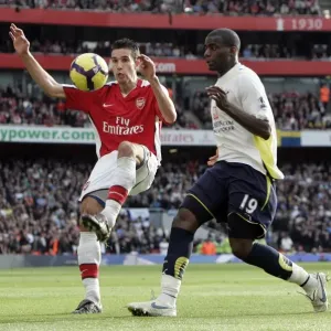 Robin van Persie (Arsenal) Sebastien Bassong (Tottenham) Robin van Persie (Arsenal) Sebastien Bassong (Tottenham)