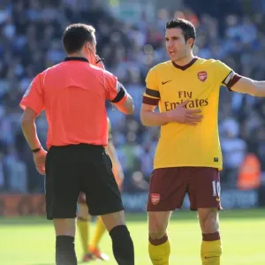 Robin van Persie (Arsenal) talks with referee Stuart Atwell. West Bromwich Albion 2