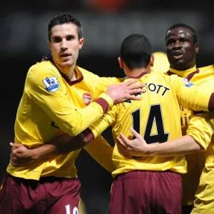 Robin van Persie celebrates scoring his 1st goal for Arsenal with Theo Walcott