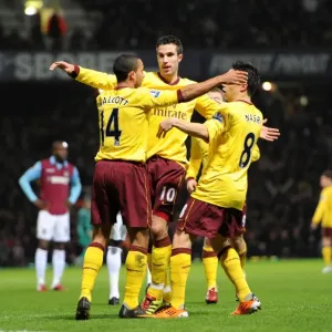 Robin van Persie celebrates scoring his 1st goal with Theo Walcott and Samir Nasri