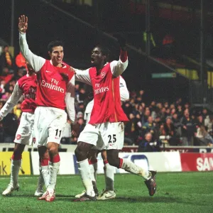 Robin van Persie celebrates scoring the 2nd Arsenal goal with Emmanuel Adebayor