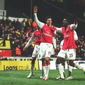 Robin van Persie celebrates scoring the 2nd Arsenal goal with Emmanuel Adebayor