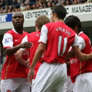 Robin van Persie celebrates scoring the Arsenal goal with Alex Hleb