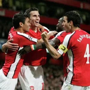 Robin van Persie celebrates scoring Arsenal's first goal in print Robin van Persie celebrates scoring Arsenal's first goal in print