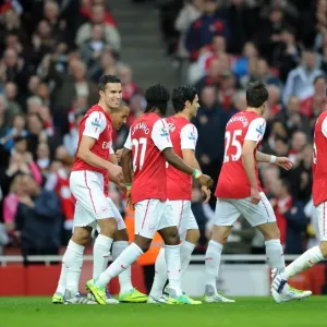 Robin van Persie celebrates scoring Arsenals 1st goal with his team mates