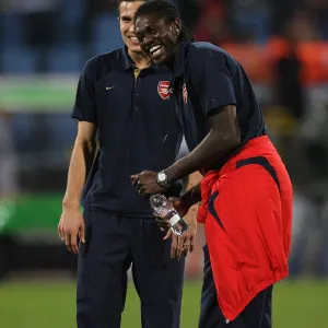 Robin van Persie and Emmanuel Adebayor (Arsenal) share a joke before the match