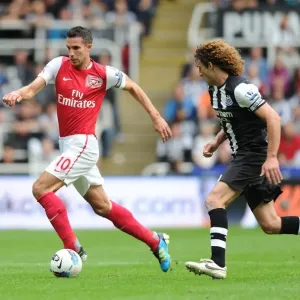 Robin van Persie Outmaneuvers Fabricio Coloccini: Newcastle United vs. Arsenal, Premier League 2011-12 Robin van Persie Outmaneuvers Fabricio Coloccini: Newcastle United vs. Arsenal, Premier League 2011-12