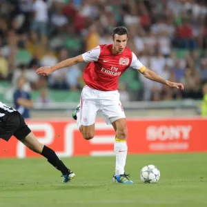 Robin van Persie Outmaneuvers Neuton: Arsenal's Star Forward in Action against Udinese (2011-12 UEFA Champions League) Robin van Persie Outmaneuvers Neuton: Arsenal's Star Forward in Action against Udinese (2011-12 UEFA Champions League)