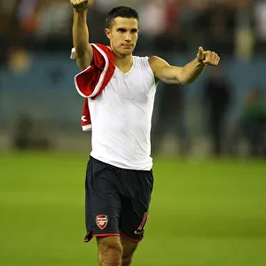 Robin van Persie salutes the arsenal fans after the match