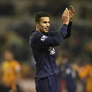 Robin van Persie salutes the Arsenal fans after the match