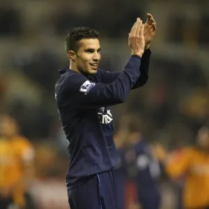 Robin van Persie salutes the Arsenal fans after the match