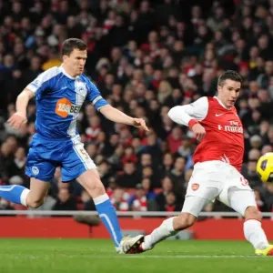 Robin van Persie scores his and Arsenals 2nd goal under pressure from Gary Caldwell Robin van Persie scores his and Arsenals 2nd goal under pressure from Gary Caldwell