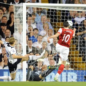 Robin van Persie scores Arsenals 3rd goal past Heurelho Gomes and Michael Dawson